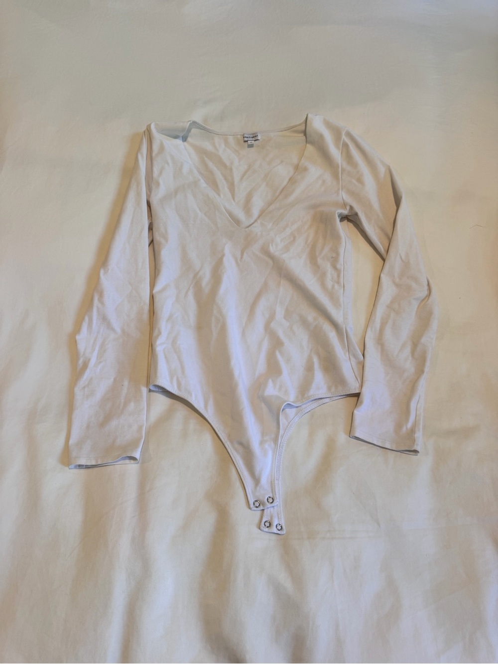 ambition White V-Neck Long Sleeve Snap-Closure Bodysuit